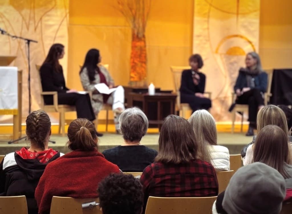 Panel discussion with speakers and audience at community event